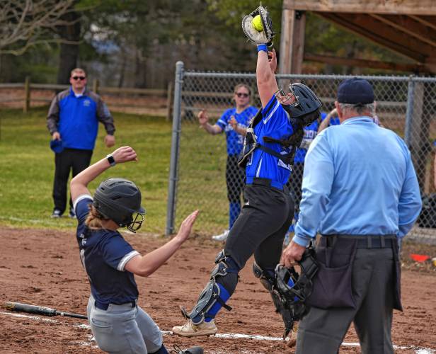 Franklin Tech’s Lindsey Taylor (1) slides safely into home ahead of a tag from Wahconah catcher Elena Iovieno during the Eagles’ season-opening victory in Turners Falls on Monday.