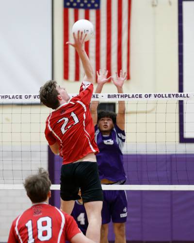Athol’s Jack Waslaske (21) hits at the net against Holyoke in the first set Friday in Holyoke.