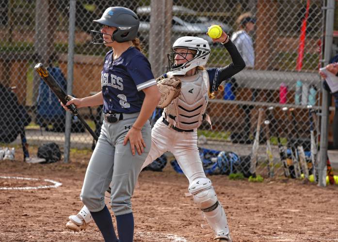 Hopkins Academy catcher Lily Ellia fires to second base while Franklin Tech batter Lilly Ross (2) steps out during action on Friday in Turners Falls.
