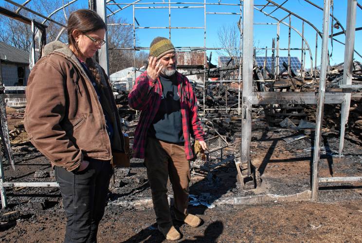 Sarah and Ryan Voiland, owners of Red Fire Farm in Granby, on Feb. 20, talk about the damage from the fire at their farm and what it will take to rebuild.