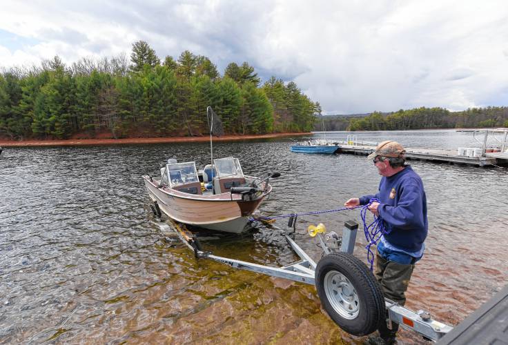 Gardner resident Gordon Charette pulls his boat up onto his trailer after fishing at Quabbin Reservoir Fishing Area 2 off Route 122 in New Salem in 2021. The reservoir will open for fishing on Saturday, April 20.