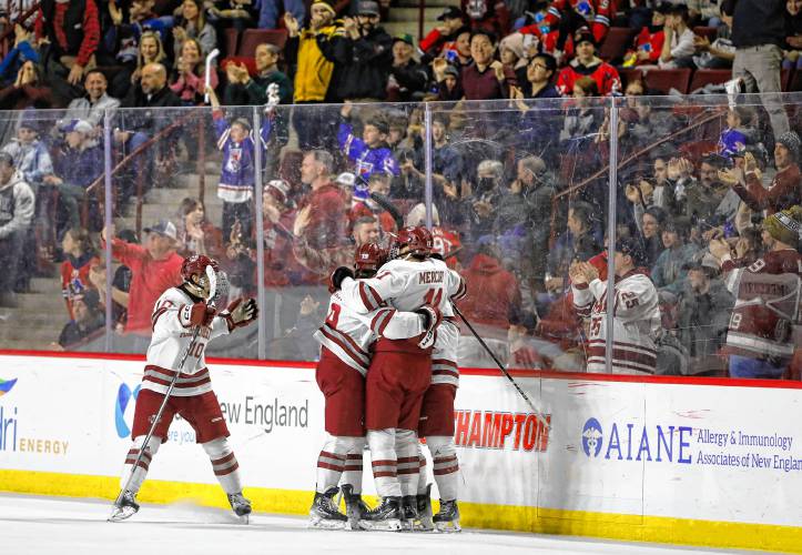 UMass hockey players celebrate a second period goal against Boston College earlier this season at the Mullins Center.