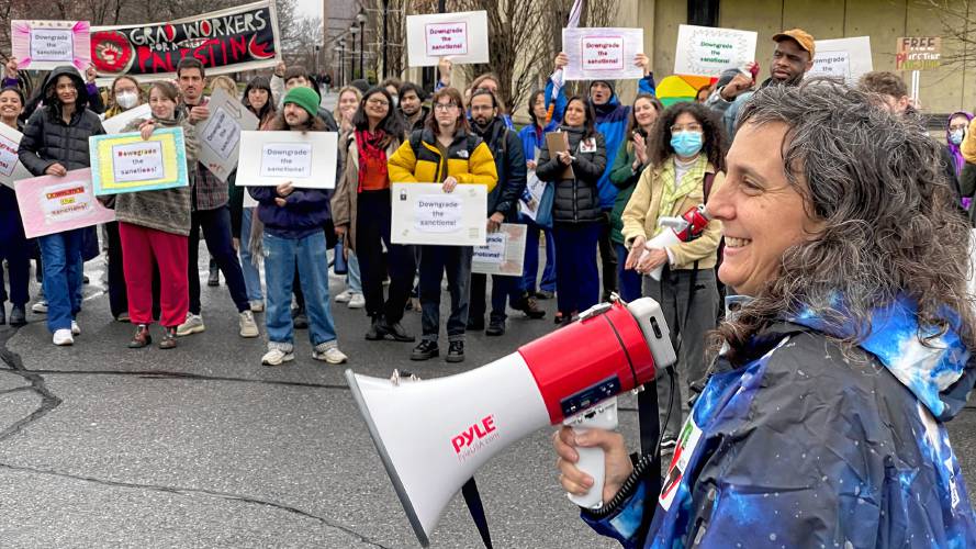 Rachel Weber, right, an instructor of social thought at UMass Amherst and the attorney representing students arrested during a sit-in protest in October over the war in Gaza, speaks at a rally in front of the school’s Whitmore Administration Building on Thursday. 
