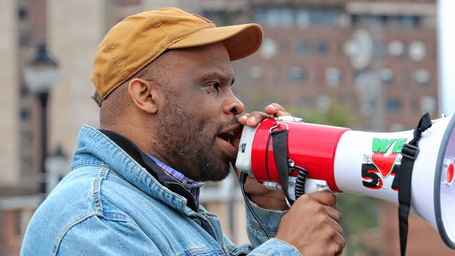 Toussaint Losier, an associate professor of Afro-American studies at UMass Amherst, speaks at a rally on Thursday.
