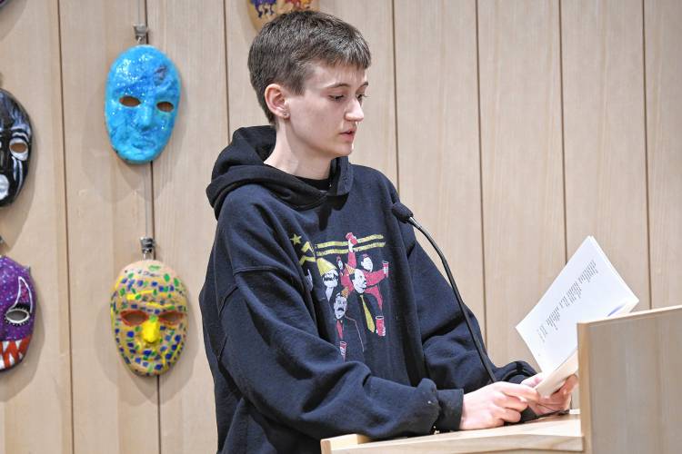 Calvin Scott, winner in the category for ages 15 to 18, reads two of his poems at the Poet’s Seat Poetry Contest awards ceremony at the Greenfield Public Library on Tuesday.