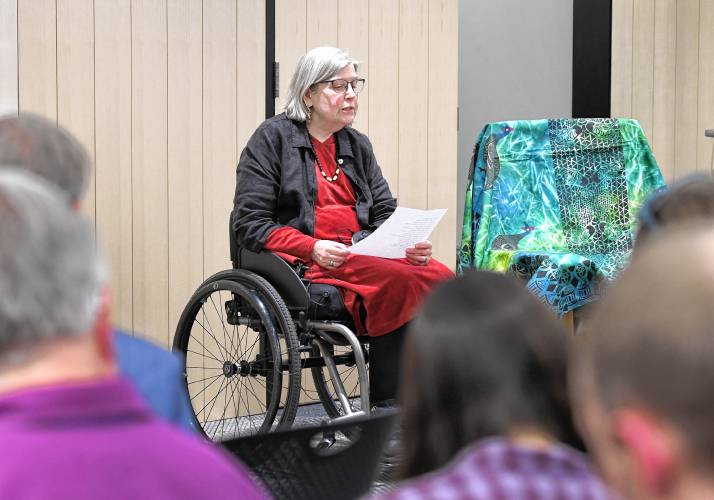 Joannah Whitney, the winner in the adult category, reads her poem “If There Was a Telescope” at the Poet’s Seat Poetry Contest awards ceremony at the Greenfield Public Library on Tuesday evening.