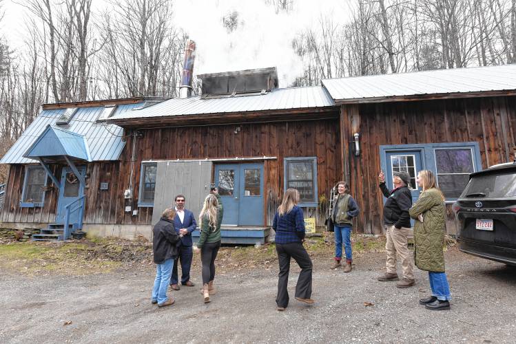 State and local officials tour the Blue Heron Farm sugarhouse in Charlemont on Monday during continued celebrations of Massachusetts Maple Month.