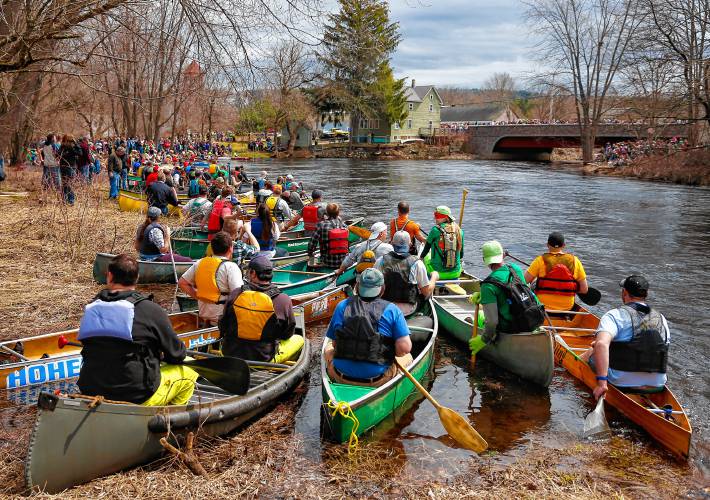 Competitors in the 2018 River Rat Race line up at the starting position along the Millers River in Athol.