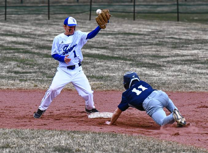 Turners Falls’ Brody Girard bobbles the throw as Franklin Tech baserunner Zaydrien Alamed is safe at second base during the Eagles’ 9-5 victory at the Bourdeau Fields Complex in Turners Falls on Tuesday.