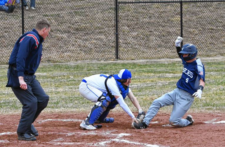Turners Falls catcher Kainen Stevens tags out Franklin Tech baserunner William Ainsworth at home plate during the Eagles’ 9-5 victory at the Bourdeau Fields Complex in Turners Falls on Tuesday.