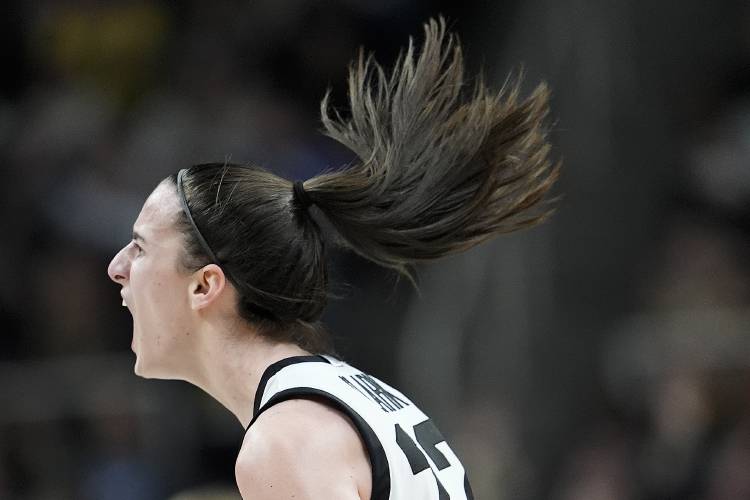 Iowa guard Caitlin Clark (22) reacts after hitting a three-point shot against LSU during the fourth quarter of an Elite Eight round college basketball game during the NCAA Tournament, Monday, April 1, 2024, in Albany, N.Y. (AP Photo/Mary Altaffer)