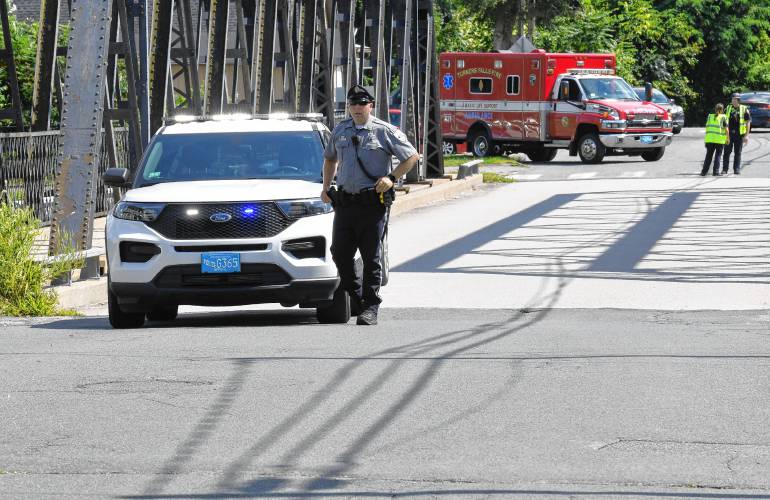 Police blocked off the 11th Street Bridge to the Patch section of Turners Falls to search for an alleged shooter on Tuesday afternoon.