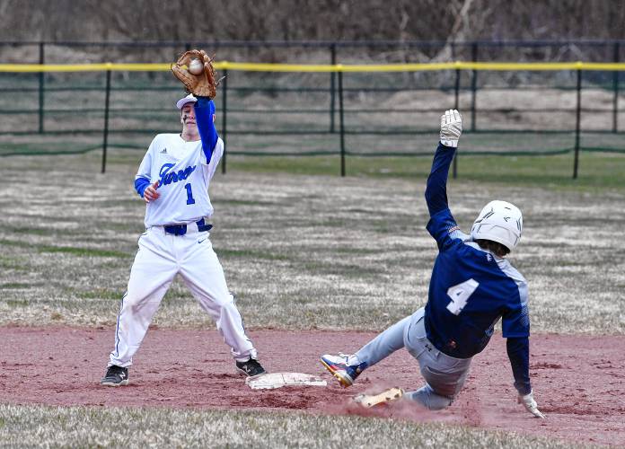 Turners Falls’ Brody Girard (1) fields the throw at second base with Franklin Tech’s Hunter Donahue (4) sliding into second base during the Eagles’ 9-5 victory at the Bourdeau Fields Complex in Turners Falls on Tuesday.