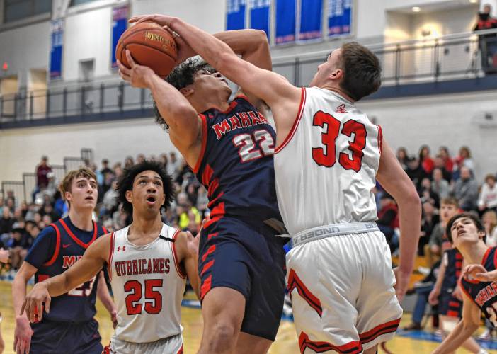 Mahar’s Jayden Delgado (22), left, goes up for a basket against Hoosac Valley’s Frank Field (33) during the Senators’ 76-44 loss in the MIAA Division 5 semifinals on Tuesday at West Springfield High School.