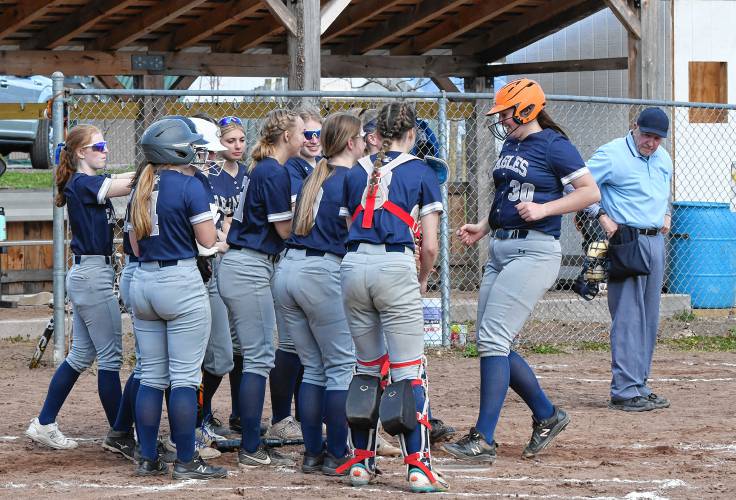 Franklin Tech’s Lilianna Inman is greeted at home plate by teammates after hitting a two-run homer in the second inning against Blackstone Valley Tech during the Eagles’ 7-3 victory at Nancy Gifford Field in Turners Falls on Tuesday. 