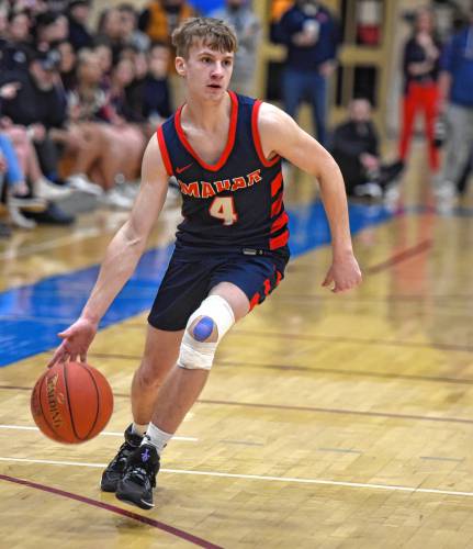 Mahar’s Lucas Isrow (4) dribbles the ball against Hoosac Valley during the Senators’ 76-44 loss in the MIAA Division 5 semifinals on Tuesday at West Springfield High School.