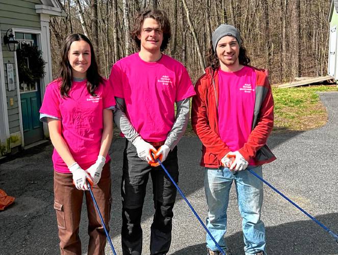 Alli Lyncosky, Shea Jackson and Mason Biagini participate in a cleanup on Upper Road in Deerfield.
