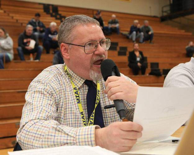 George Miller broadcasting a state semifinal game in 2019 at Butova Gym at AIC in Springfield. Miller was announced as the Tom Cove Award winner from IAABO Board 28