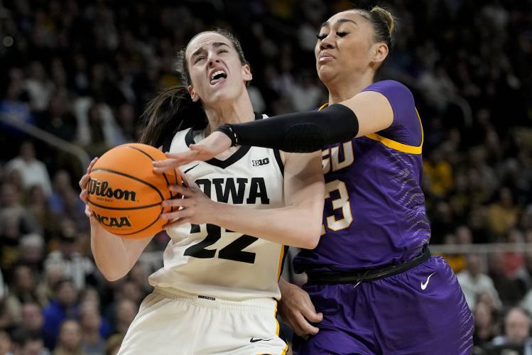 Iowa guard Caitlin Clark (22) goes up for a shot against LSU guard Last-Tear Poa (13) during the first quarter of an Elite Eight round college basketball game during the NCAA Tournament, Monday, April 1, 2024, in Albany, N.Y. (AP Photo/Mary Altaffer)