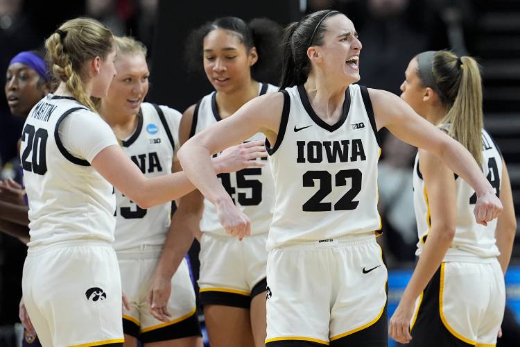 Iowa guard Caitlin Clark (22) reacts during the fourth quarter of an Elite Eight round college basketball game against LSU during the NCAA Tournament, Monday, April 1, 2024, in Albany, N.Y. (AP Photo/Mary Altaffer)