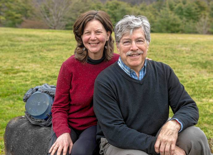 Josh Simpson and his wife, Cady Coleman, outside their home in Shelburne Falls. Simpson is a finalist for the 2024 Valley Voices Story Slam crown; hae and 11 other competitors will tell their tales at Northampton’s Academy of Music April 13.