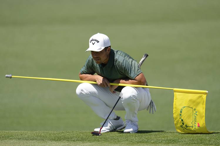 Xander Schauffele lines up a putt on the second hole during second round at the Masters golf tournament at Augusta National Golf Club Friday, April 12, 2024, in Augusta, Ga. (AP Photo/George Walker IV)