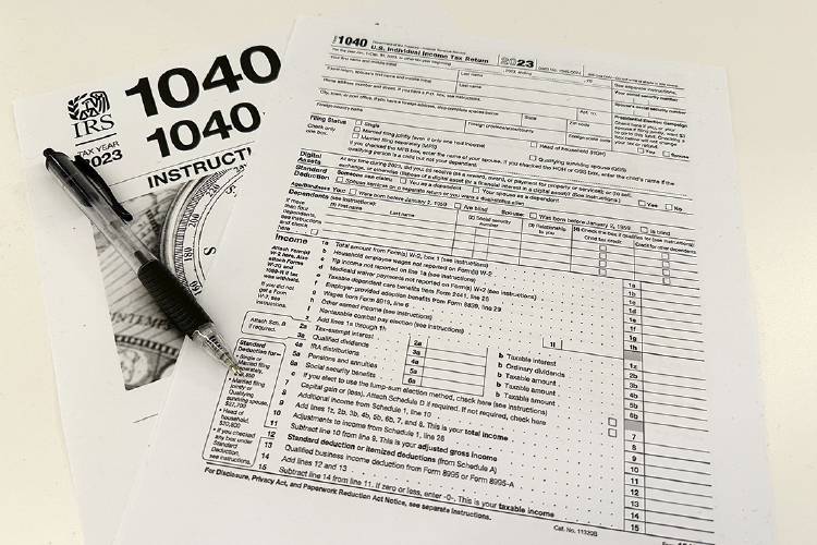 An Internal Revenue Service 2023 1040 tax form and instructions. Massachusetts residents have until 11:59 p.m. on April 17 to file both state and federal income taxes, a two-day extension from the normal deadline due to the state’s Patriots’ Day holiday.