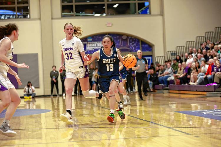 Smith College's Jane Loo drives to the basket against NYU in the NCAA Div. III Women's Basketball National Championship game in Columbus, Ohio on Saturday.