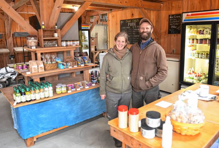 Co-owners Maggie Toran and David Fisher in their farm store at Natural Roots farm in Conway.