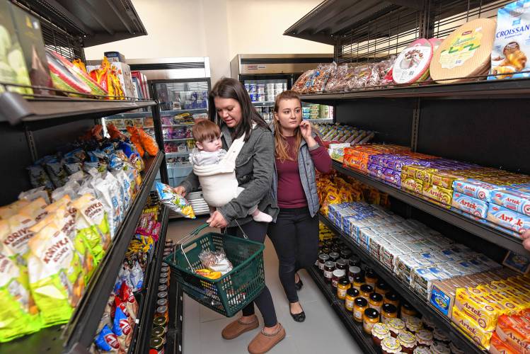 People shop at International Supermarket on Main Street in Greenfield. The store opened Wednesday selling imported goods from Romania, Ukraine, Moldova, Poland and Lithuania.