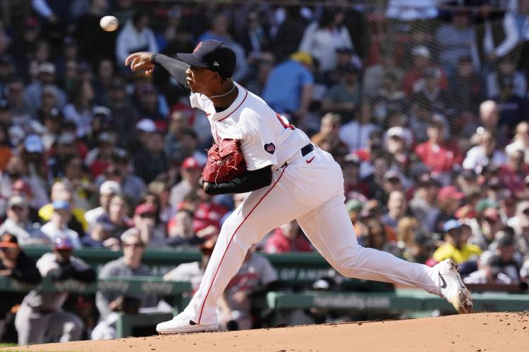 Boston Red Sox’s Brayan Bello pitches against the Baltimore Orioles in the first inning during an opening day game at Fenway Park on Tuesday in Boston. 