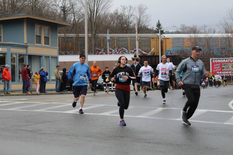 Runners brave the rain for the Big Cheese 5K in 2022 as part of the River Rat Race festivities.