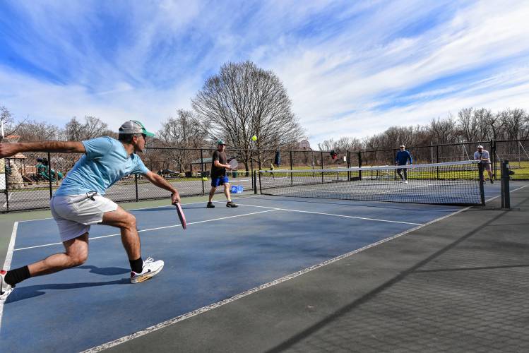 Julian Sieser, Charlie Tormanen, Luke Williams and Jonathan MacLeod play pickleball at the Green River Park in Greenfield on Friday.