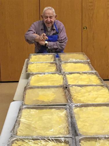 Russell Deane, 95, looks over chicken pot pie dough ahead of a Bernardston Kiwanis Club fundraiser. Deane was a founding member of the Bernardston Kiwanis Club and the club is hosting its annual fundraiser for The United Arc this weekend in memory of his wife Lillian and his daughter, Nancy Lee.