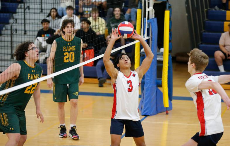 Frontier’s Tavo Vincent-Warner (3) sets against Southwick in the third set of the Western Massachusetts Class C boys volleyball championship at Chicopee Comp last spring. 