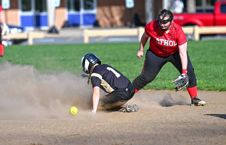 Pioneer’s Laylah Goulston takes second as Athol’s Jenna Bonenfant corrals the throw in Northfield on Tuesday. 