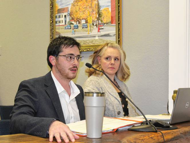 Orange Town Administrator Matthew Fortier, left, speaks to the Selectboard while Administrative Assistant Brianne Bruso looks on at Wednesday’s meeting.