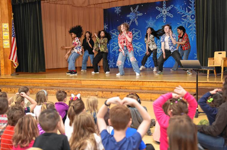 One of two groups of students from the University of Massachusetts Amherst perform a K-pop dance number for students at Buckland-Shelburne Elementary School during an all-school assembly on Wednesday. The school has a student, Hajun Sung, from South Korea. His mother, Hyunju Kang, gave a talk introducing their country’s culture and language to the students.