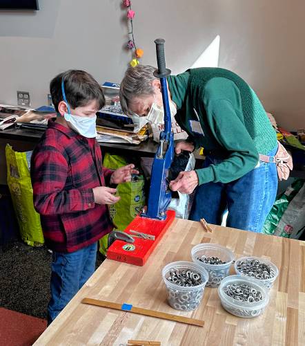 Greening Greenfield hosted a workshop on using empty bags of animal feed to make reusable shopping bags at the Greenfield Public Library Makerspace on Saturday.