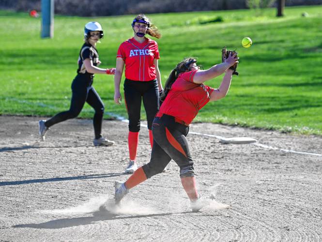Athol pitcher Jaylynn Chapalonis tries to reel in an infield fly against Pioneer in Northfield on Tuesday. 