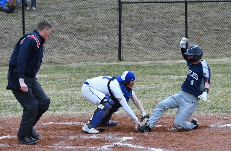 Turners Falls catcher Kainen Stevens tags out Franklin Tech base runner William Ainsworth last week in Turners. 