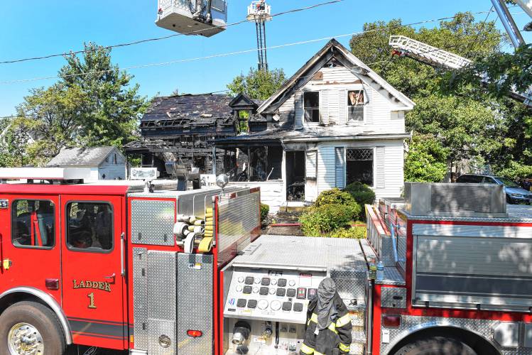 Multiple fire departments battled a three-alarm house fire at 92 Fern St. in Athol on Thursday morning.