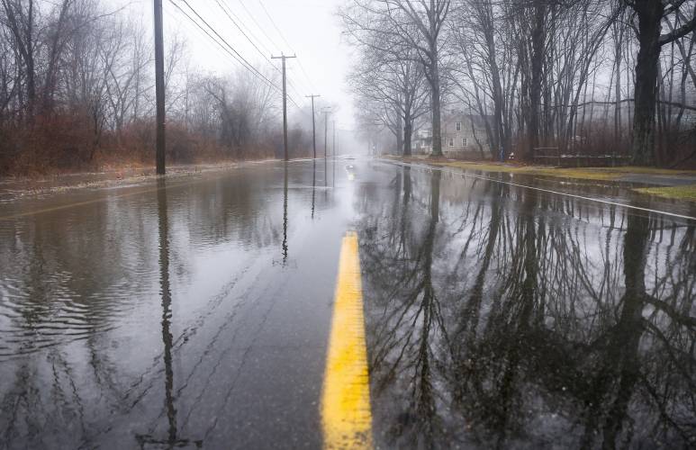 Water surges over Montague City Road after periods of heavy rainfall in 2018. After years of planning and exploring funding options, the Montague Selectboard has finally executed a $326,495 contract to remediate the recurring flooding issues.