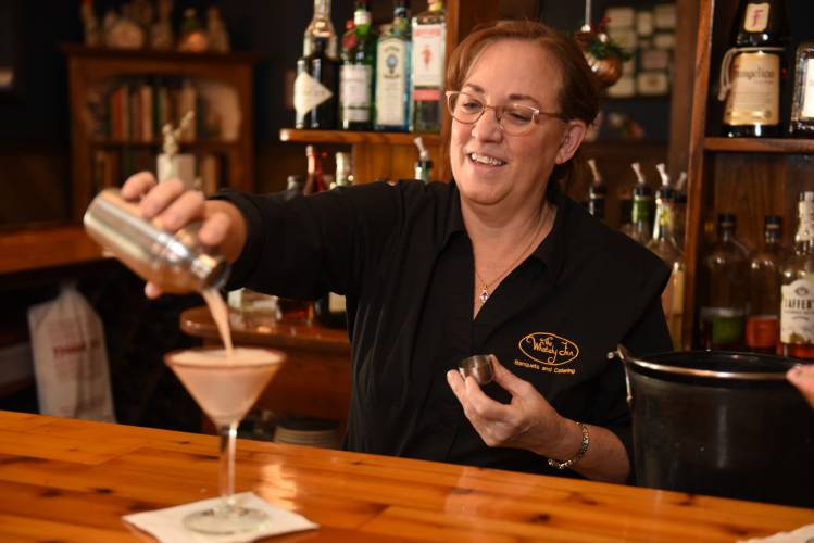 Lisa Kloc, owner/manager at The Whately Inn, pours a Sugar Cookie Martini at the bar at the Whately eatery.