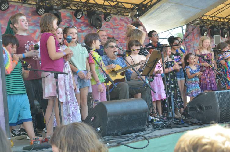 Mike Turk leads children in song on the Main Stage at this year’s Wormtown Music Festival at Camp Kee-wanee in Greenfield.
