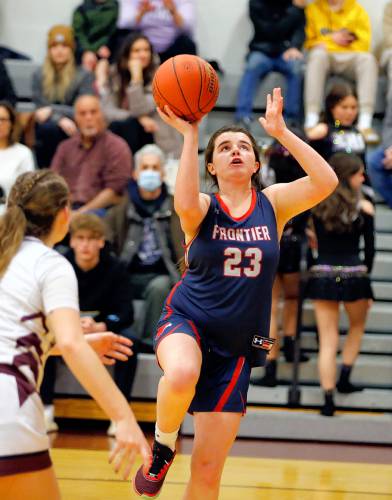 Frontier’s Molly Gates (23) goes in for a layup against Easthampton in the second quarter Thursday night in Easthampton.