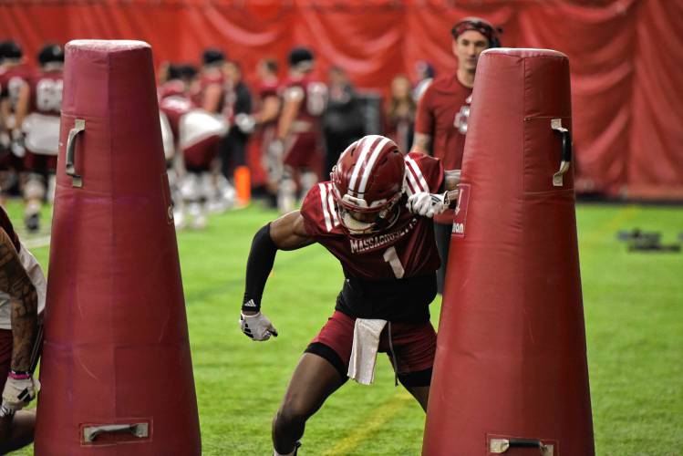 UMass senior wide receiver Anthony Simpson bursts through the line with a quick release during the Minutemen’s first spring practice of the season on Tuesday morning in Amherst.