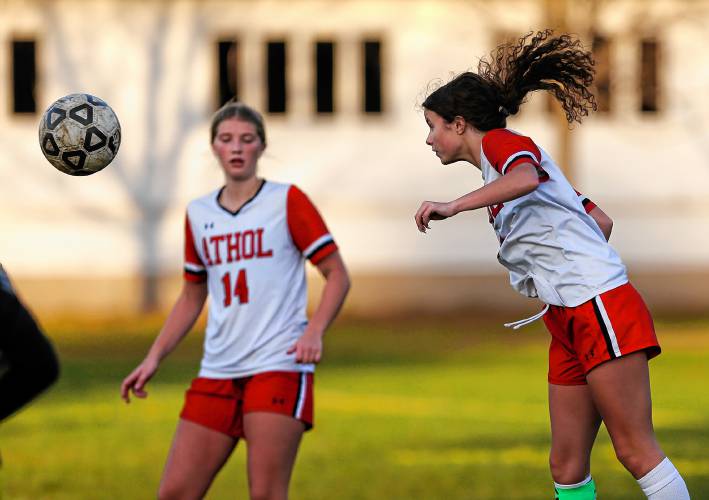 Athol’s Samantha Mailloux (6), right, heads the ball against Smith Vocational in the second half Friday in Northampton.