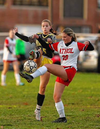Smith Vocational’s Caitlin Willard (15) left, fights for possession against Athol’s Emily King (20) in the second half Friday in Northampton.