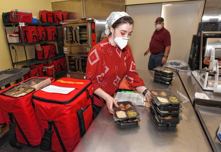 Bryanna Nadeau organizes meals for delivery through LifePath’s Meals on Wheels program in 2022. Those looking to support Meals on Wheels while enjoying music are invited to a free benefit concert, to be held at Northfield Mount Hermon School’s Rhodes Arts Center on Sunday, Feb. 18, at 3 p.m.
